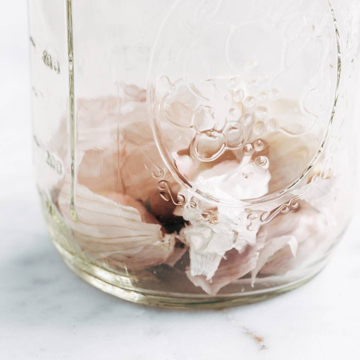 Garlic peels in a mason jar.