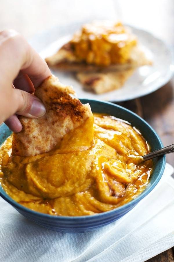 Pumpkin hummus in a blue bowl.