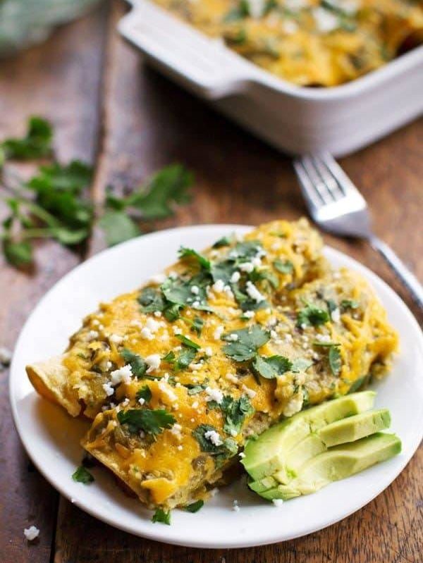 Butternut Squash and Mushroom Enchiladas with Tomatillo Sauce - corn tortillas stuffed with veggies and smothered in homemade sauce and cheese for just 250 calories. YES. | pinchofyum.com