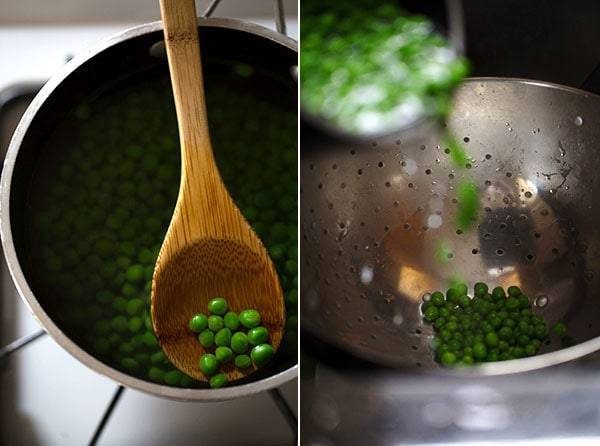 Green peas on a wooden spoon and in a colander.