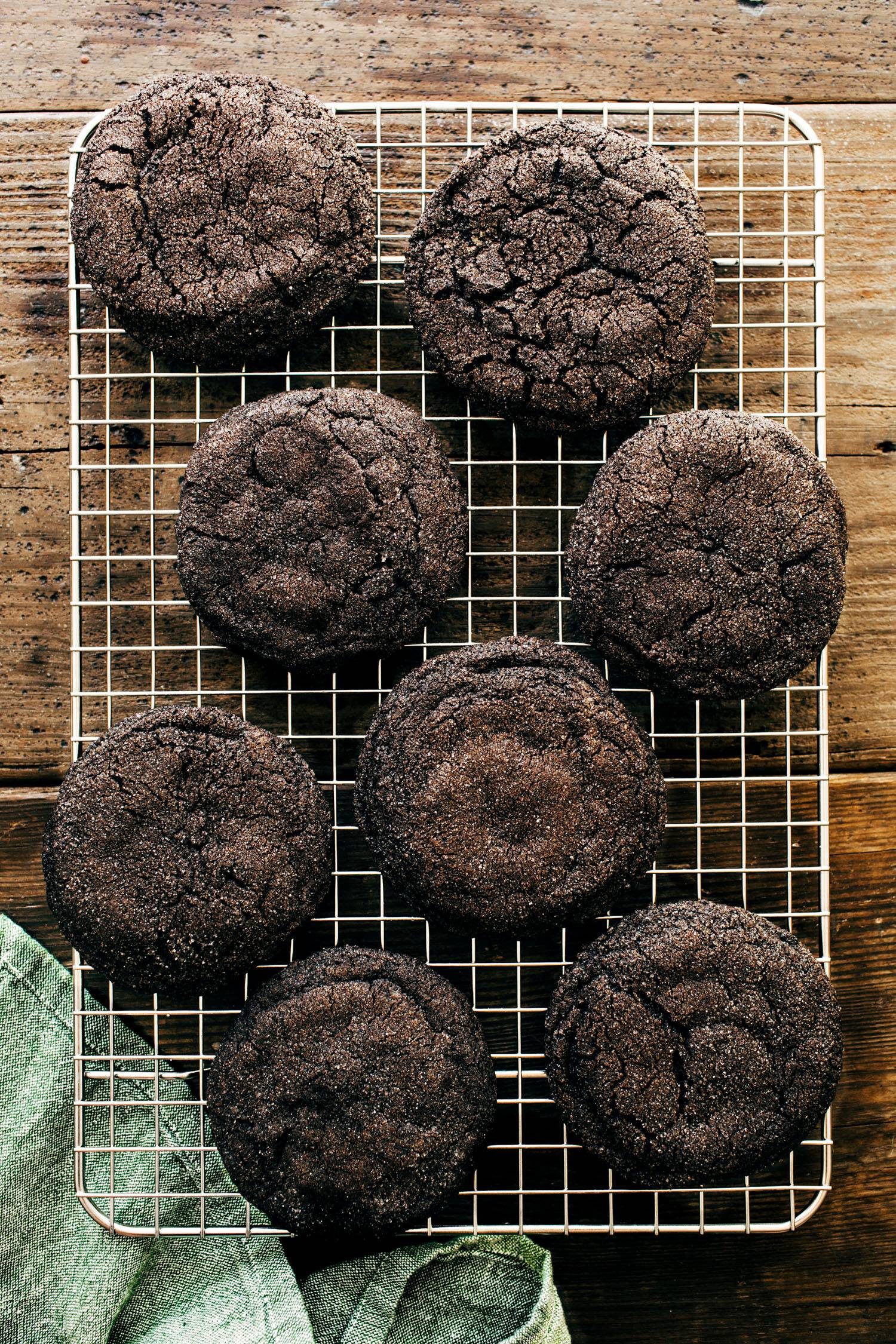 Dark chocolate cookies on a cooling rack.