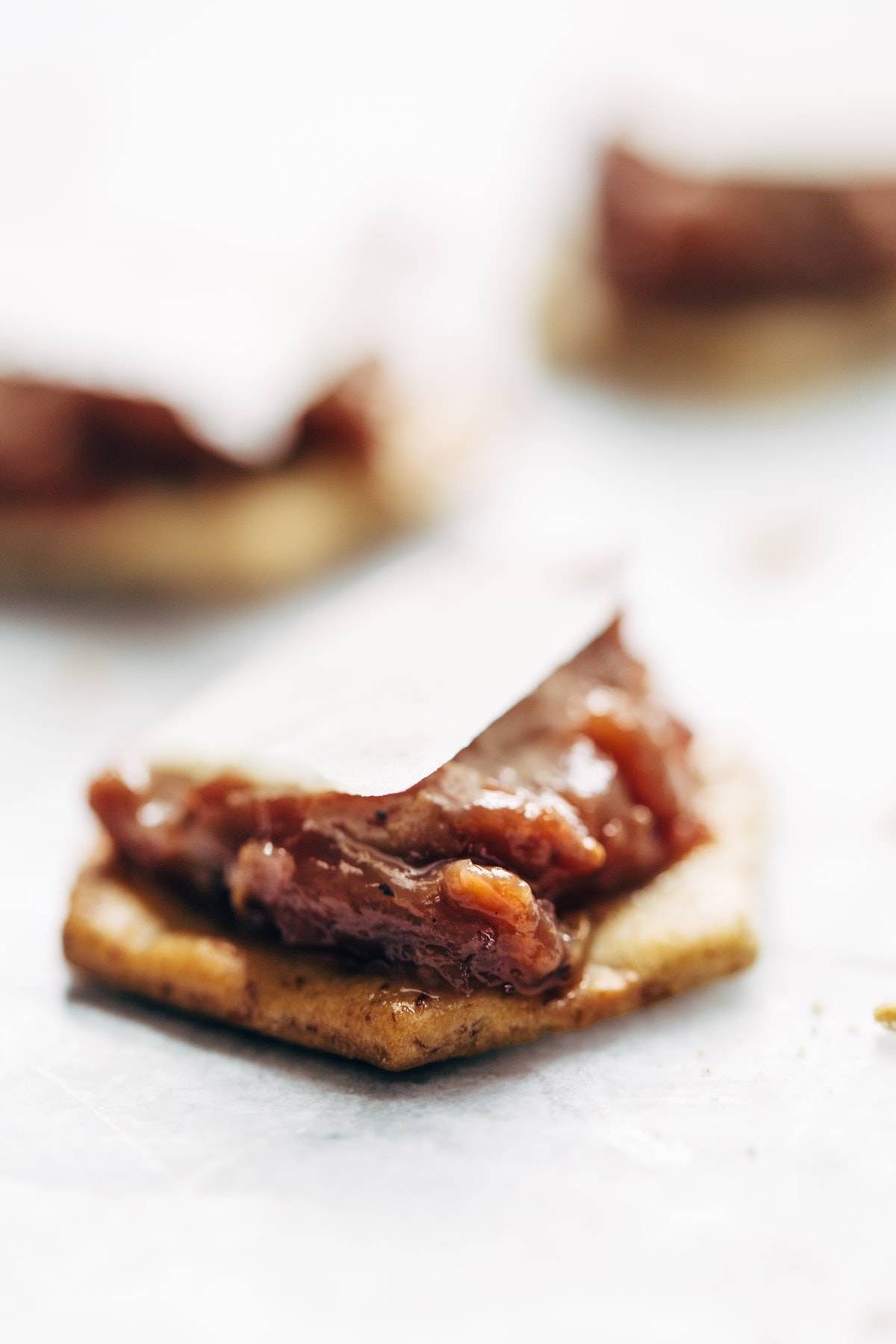 Caramelized Shallot and Grape Chutney! Made with shallots, grapes, red wine, cinnamon, bourbon, and vinegar. So good with plate of crispy crackers! | pinchofyum.com