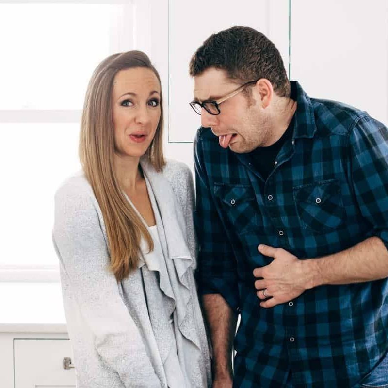 Lindsay and Bjork making silly faces in their kitchen.