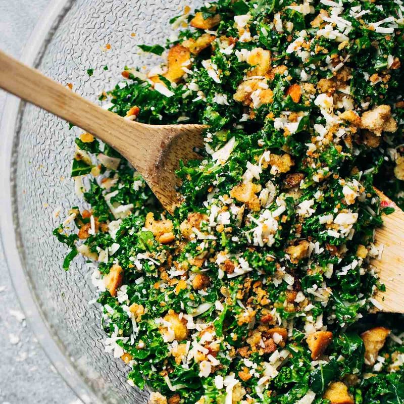 The Best Simple Kale Salad featuring a lemon and olive oil dressing, homemade breadcrumbs, and Parmesan cheese. YUM!