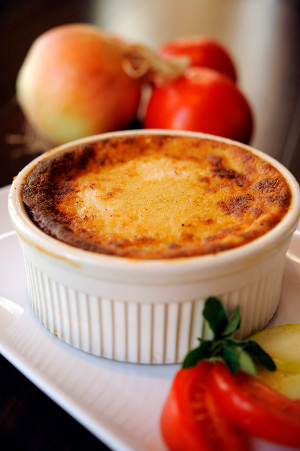 Kouzzina Pastitisio, with bucatini pasta, cinnamon-stewed meat sauce, and béchamel sauce