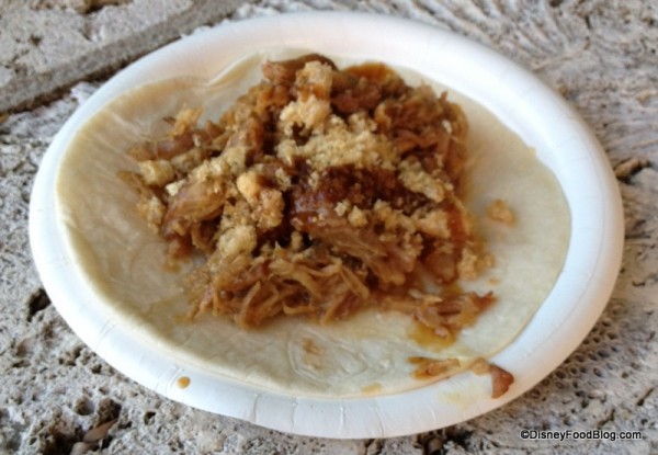 Tacos de Carnitas -- Pork tacos topped with Tamarindo Salsa served on a flour tortilla with chicharron