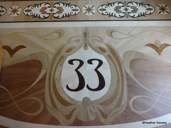 The inlaid wood floors include the club's new logo.