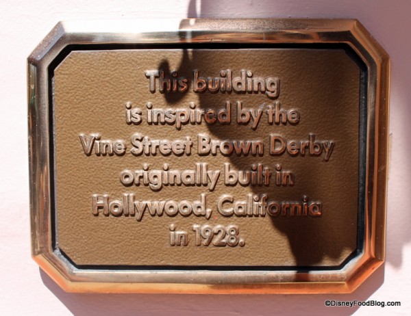 Plaque noting the inspiration for the building