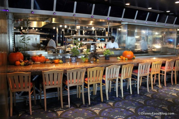 Bar seating in front of the kitchen