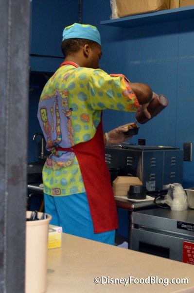 Cast Member Preparing the Grits