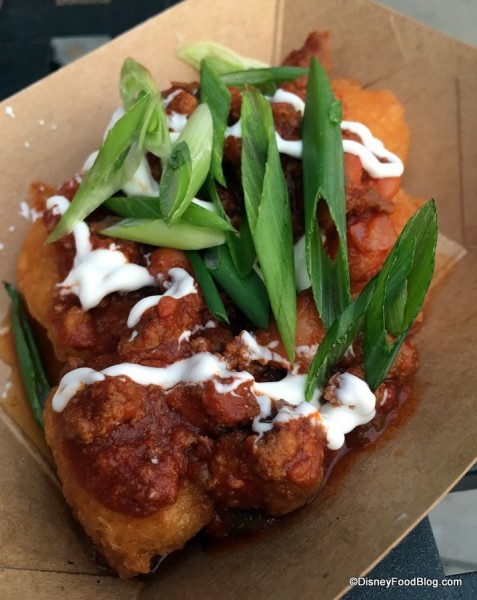 Sweet corn nuggets with beef chili, spring onions and sour cream