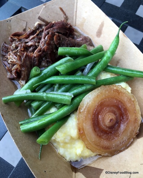Braised Wagyu beef on creamy polenta with haricot vert and red onion salad and roasted Cipollini onion