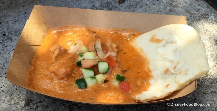 Korma Chicken with Cucumber Tomato Salad, Almonds, Cashews, and Warm Naan Bread