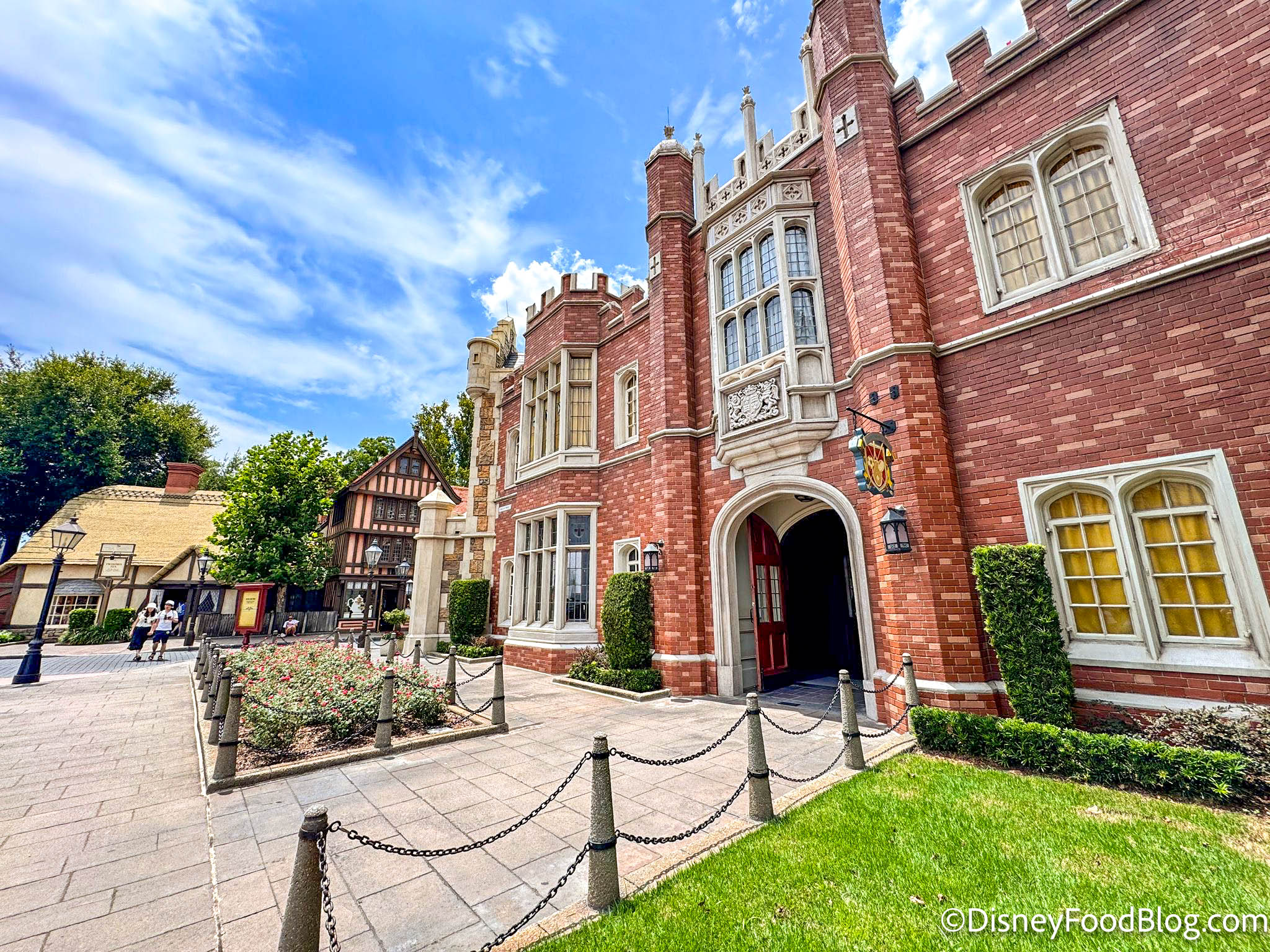 tall brick building with arched entry way