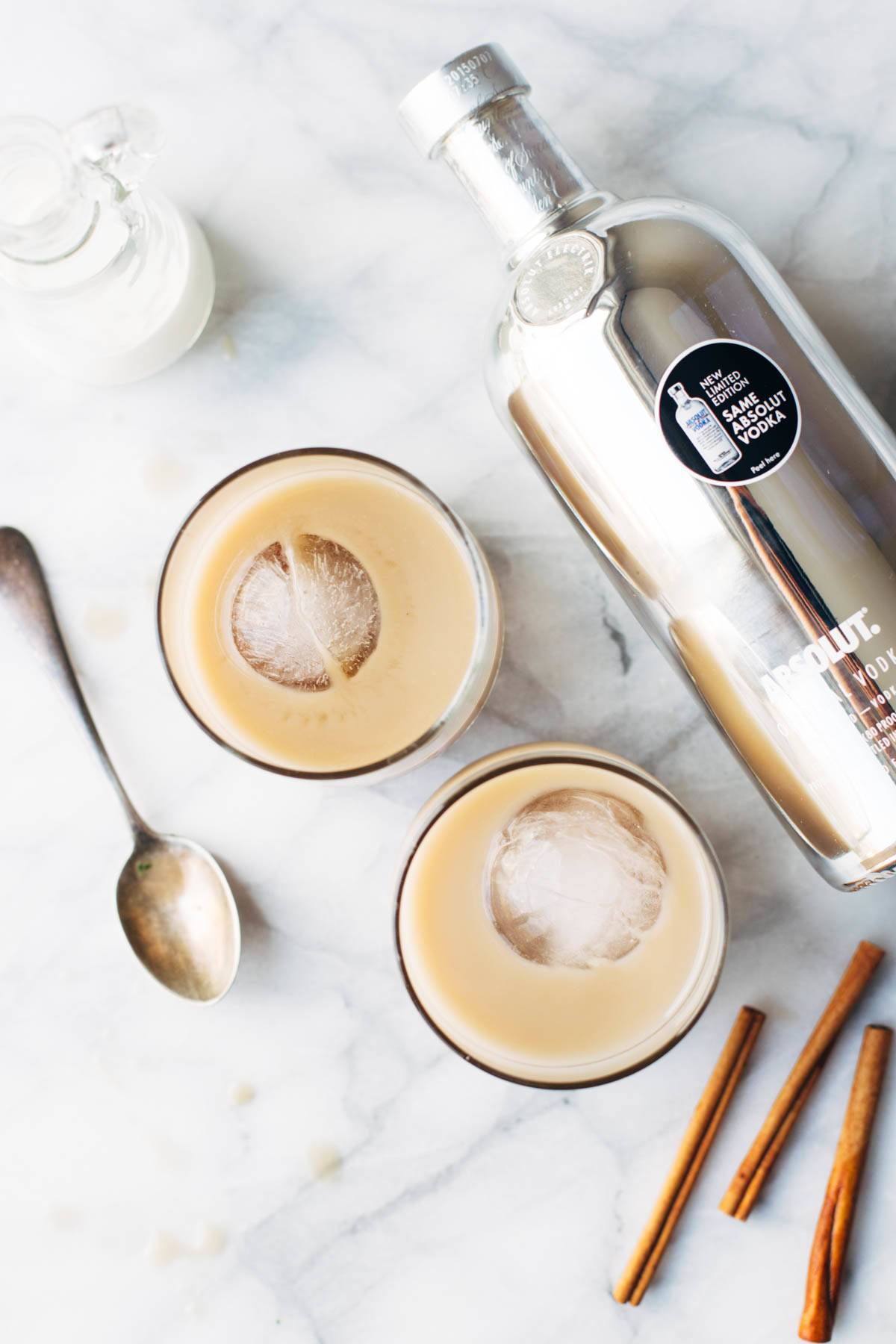 This Cinnamon White Russian is a perfect holiday party drink! with just four ingredients - vodka, coffee liquor, cinnamon simple syrup, and cream. | pinchofyum.com