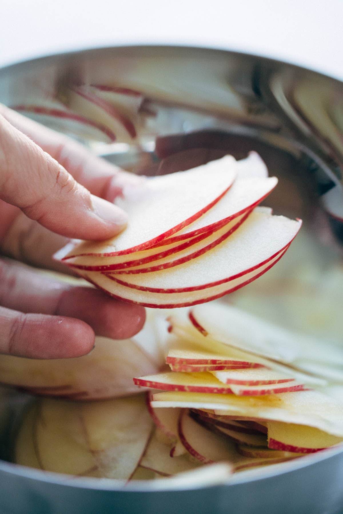 These layered bars are so simple! Loaded with homemade caramel and apples. Caramely apple layer tucked in by a brown sugar-y crust on both sides. | pinchofyum.com