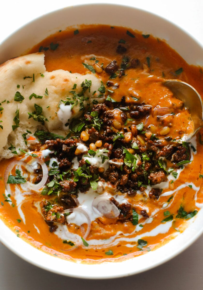 Carrot soup with ground beef topping.