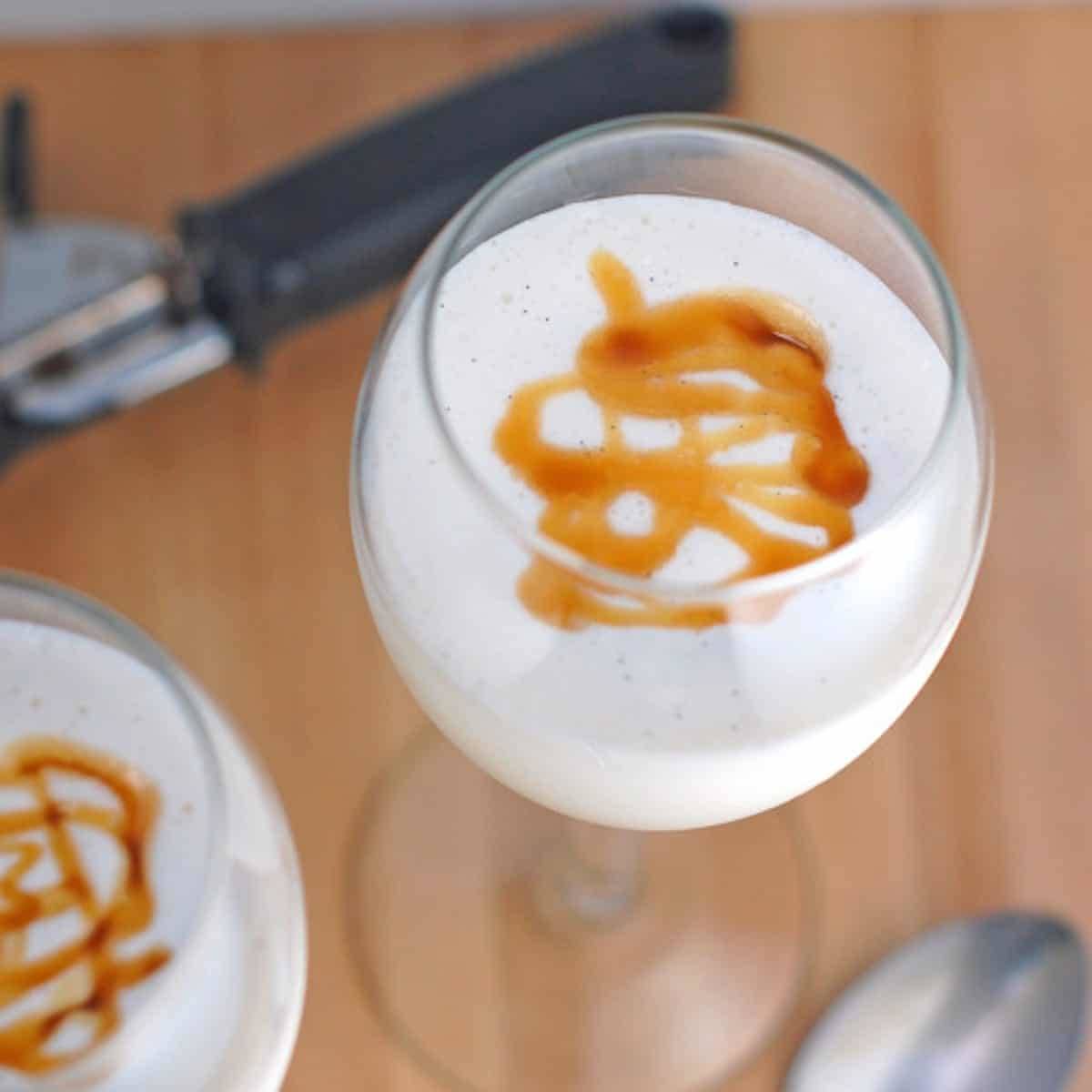 Coconut caramel malt with caramel drizzle in a glass.