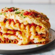 Layers of lasagna set on a plate.