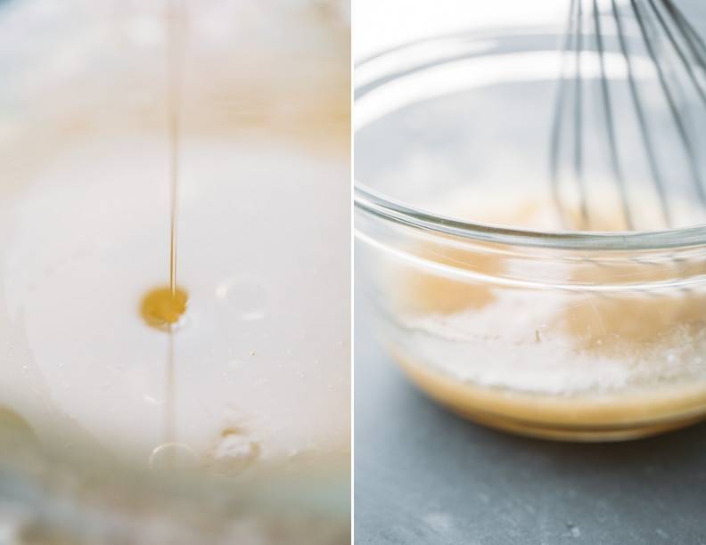Citrus dressing in a mixing bowl with a whisk.