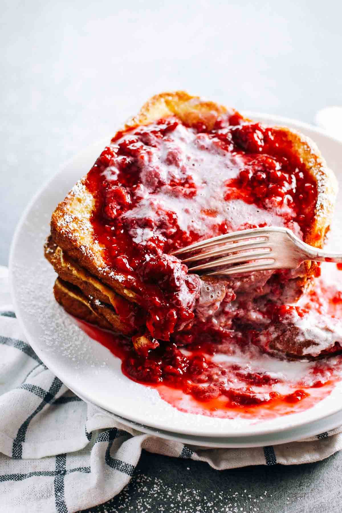 Eggnog French Toast with raspberry sauce.